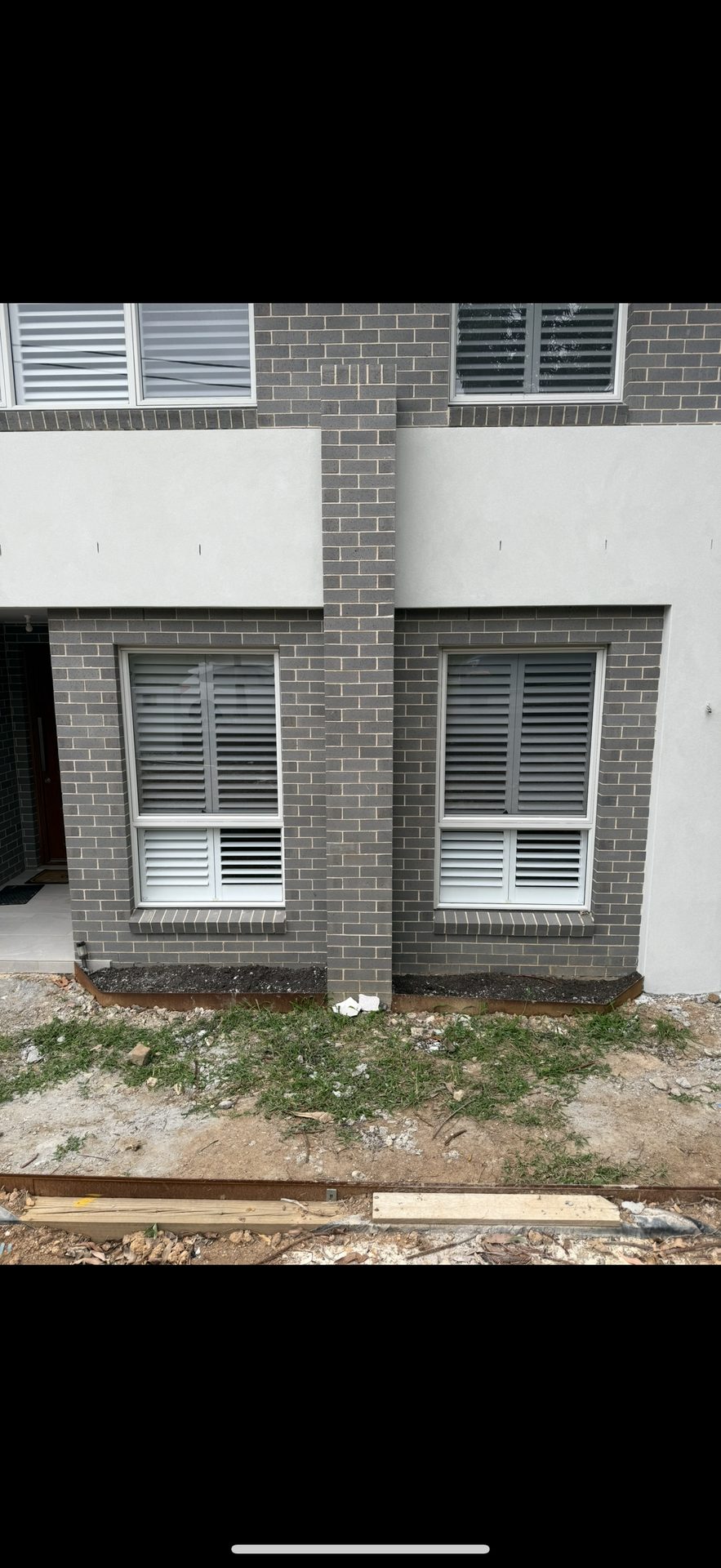 House facade before stone feature tiling Sydney