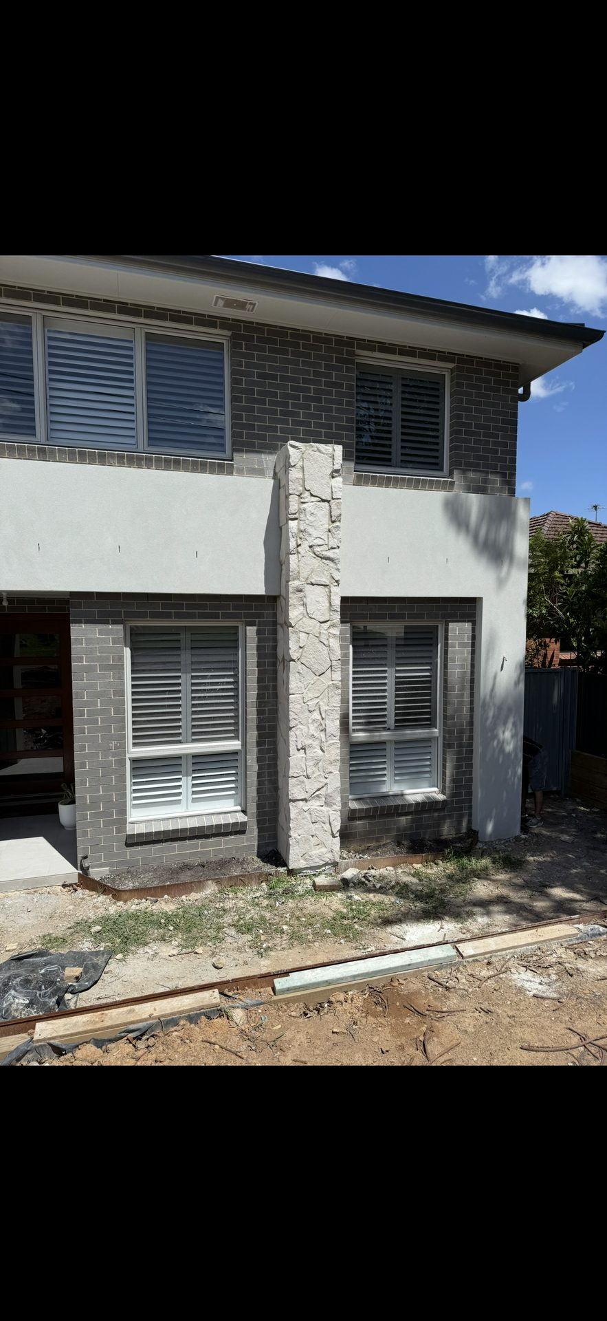 House facade after stone feature column tiling Sydney