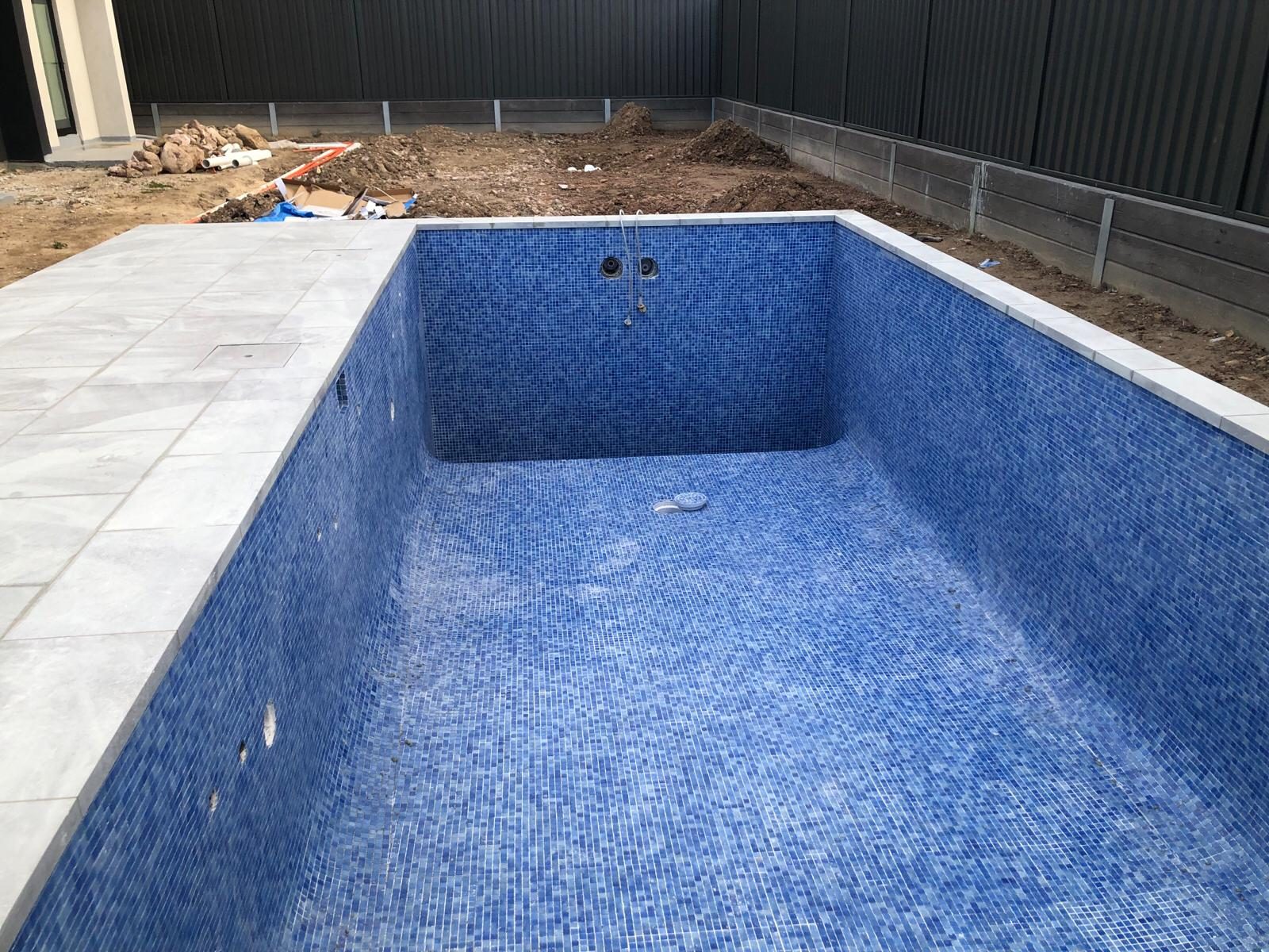 Blue glass mosaic tiled swimming pool interior — pool tiling Sydney