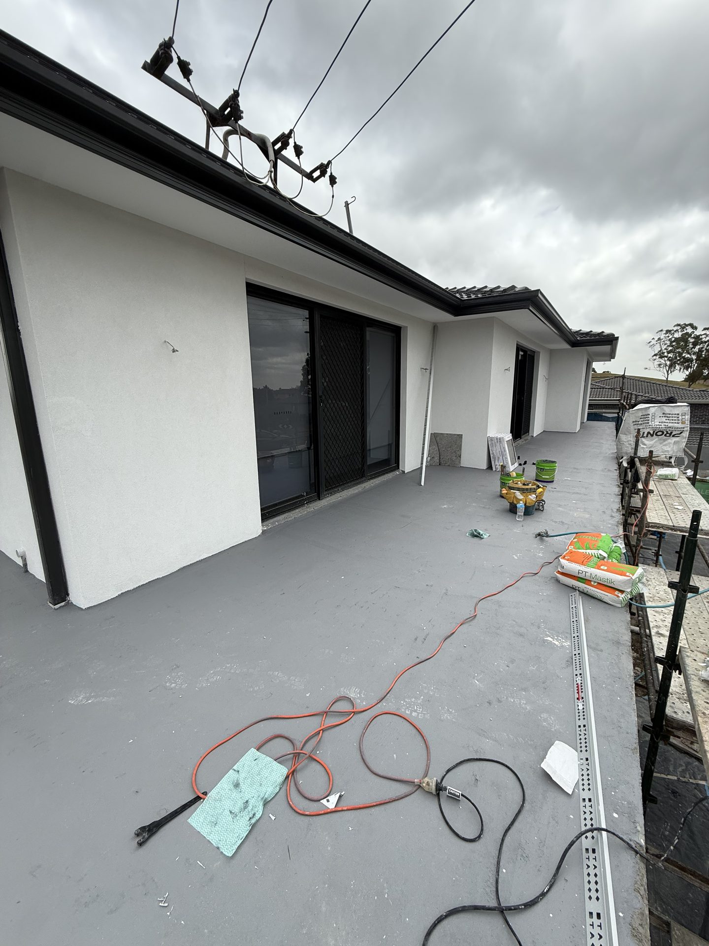 Wet area waterproofing coat applied — Sydney bathroom tiling preparation