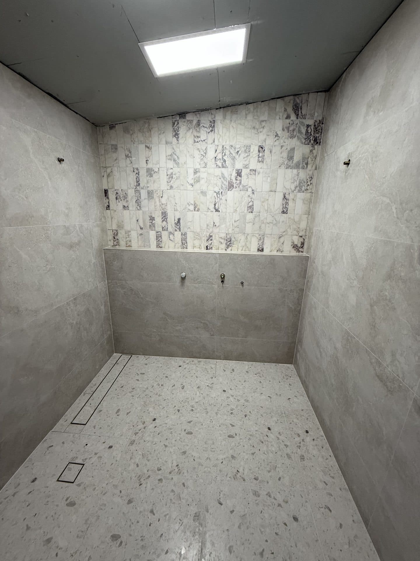 Subway tile bathroom wall and floor tiling — Sydney