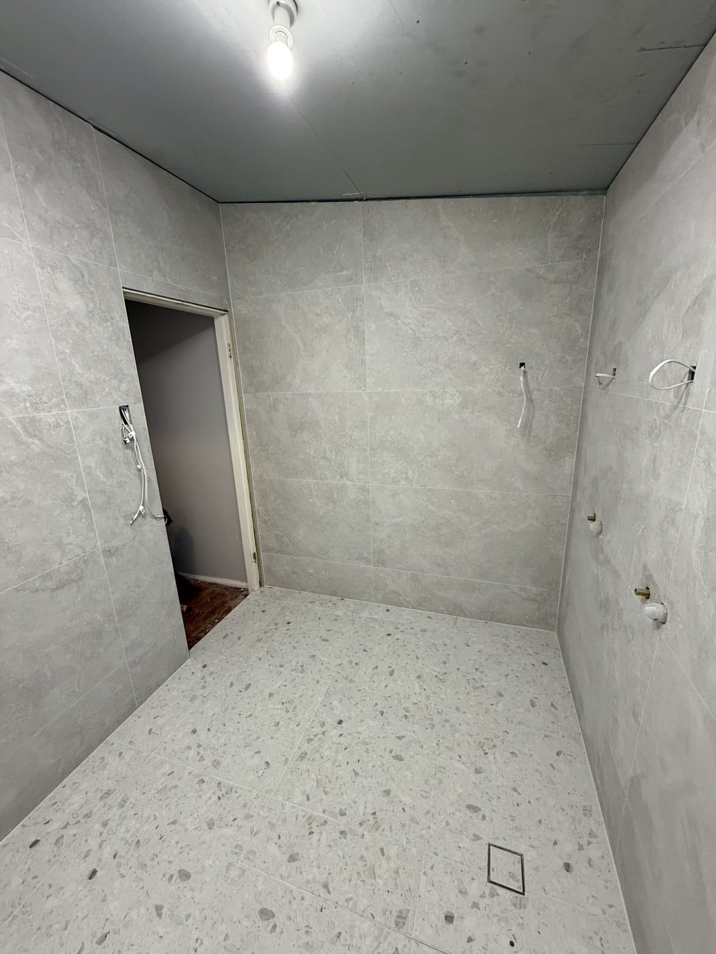 Matte porcelain bathroom floor tiles — tiling Sydney