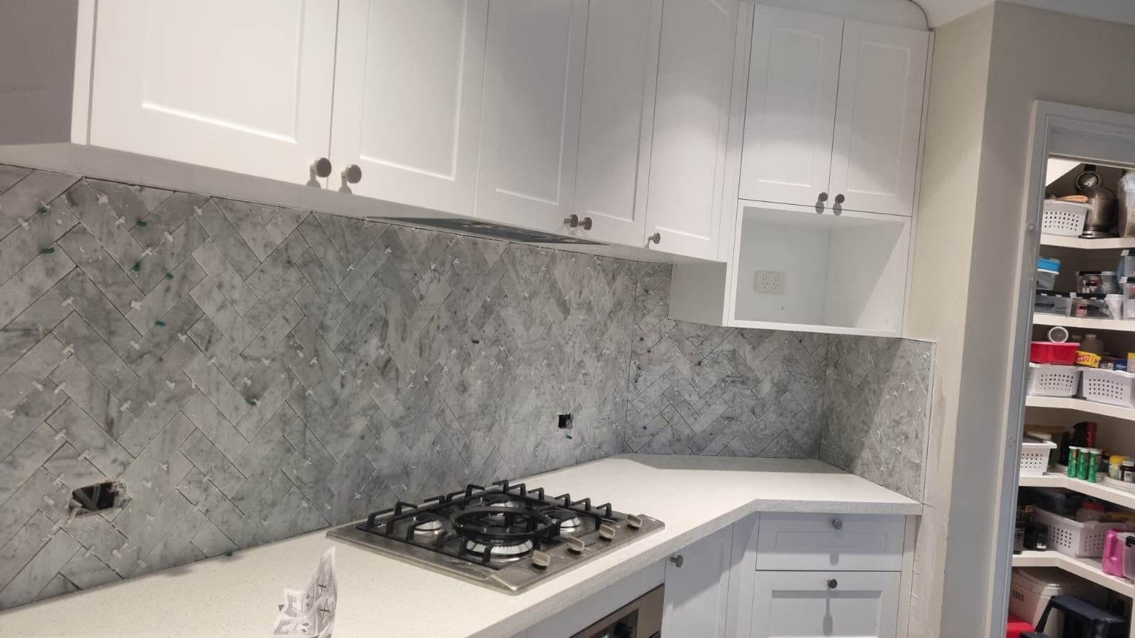 Grey marble herringbone pattern kitchen splashback — Sydney